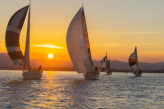 Yachts under sail and silhouet